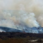 Wildfire in Aurora Colorado producing heavy smoke as firefighters respond