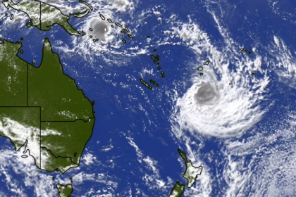 tropical cyclone approaching New Zealand with strong winds and heavy rain visible on satellite