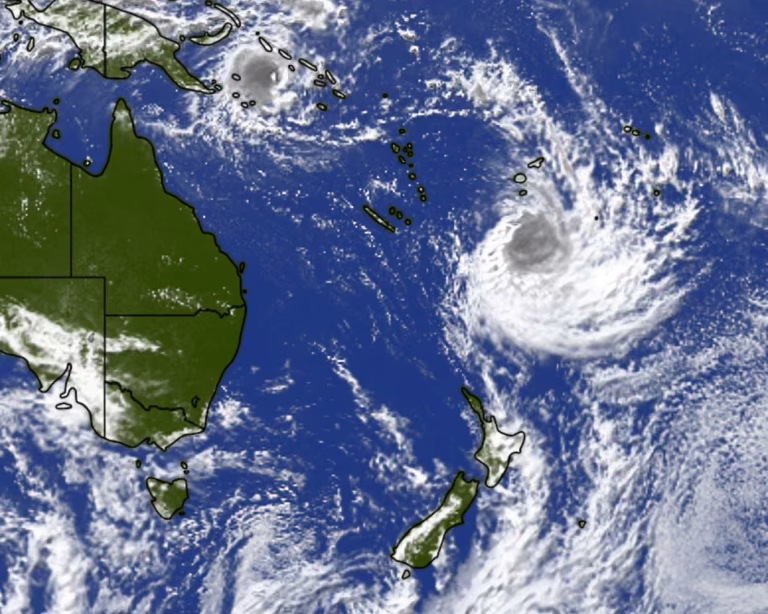 tropical cyclone approaching New Zealand with strong winds and heavy rain visible on satellite