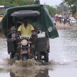 severe flooding in Angola with submerged streets and damaged homes after heavy rain