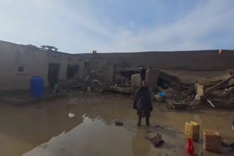 Afghanistan flood destruction with collapsed homes and muddy water after heavy rainfall disaster