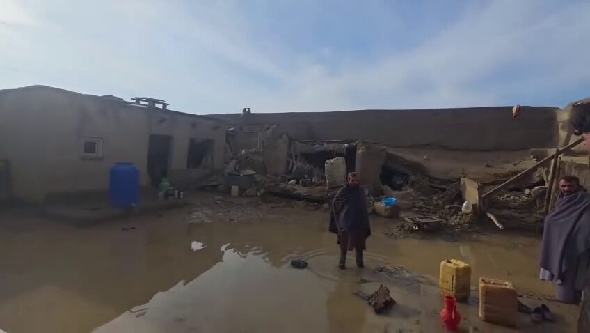 Afghanistan flood destruction with collapsed homes and muddy water after heavy rainfall disaster